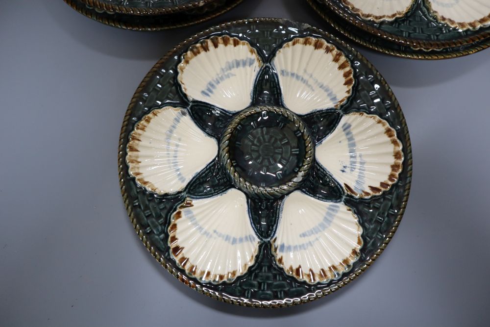 A set of five Longchamp maiolica oyster dishes, 24cm